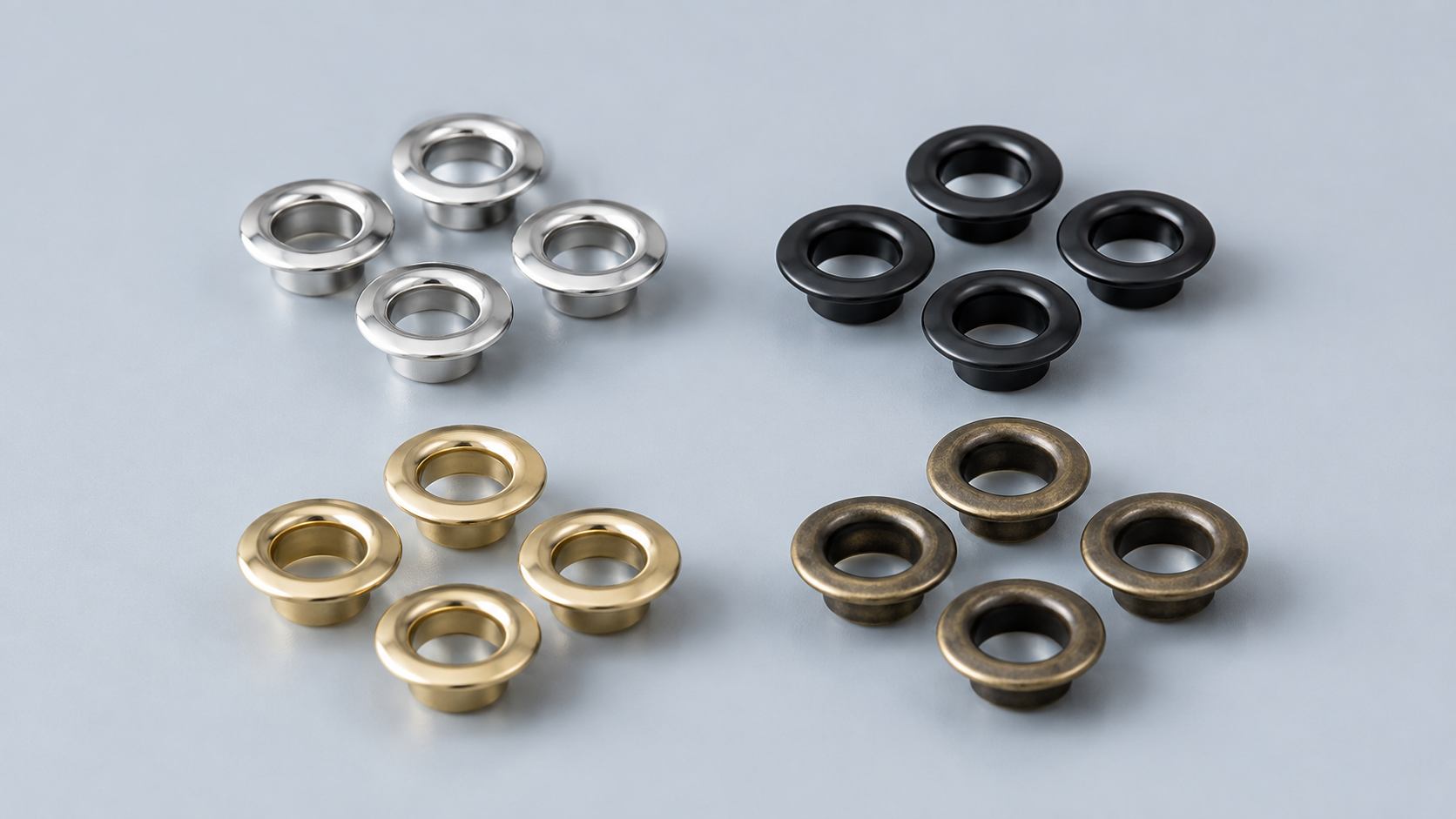 what does a grommet look like, This image shows what does a grommet look like with round metal grommets in several sizes and finishes.